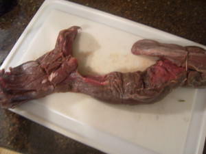 a whole, uncooked beef tenderloin