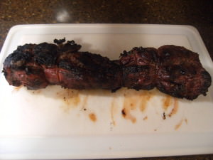 A cooked beef tenderloin - marinated in bourbon and fresh herbs.