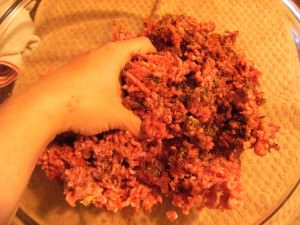 mixing seasonings into ground beef for butter burgers