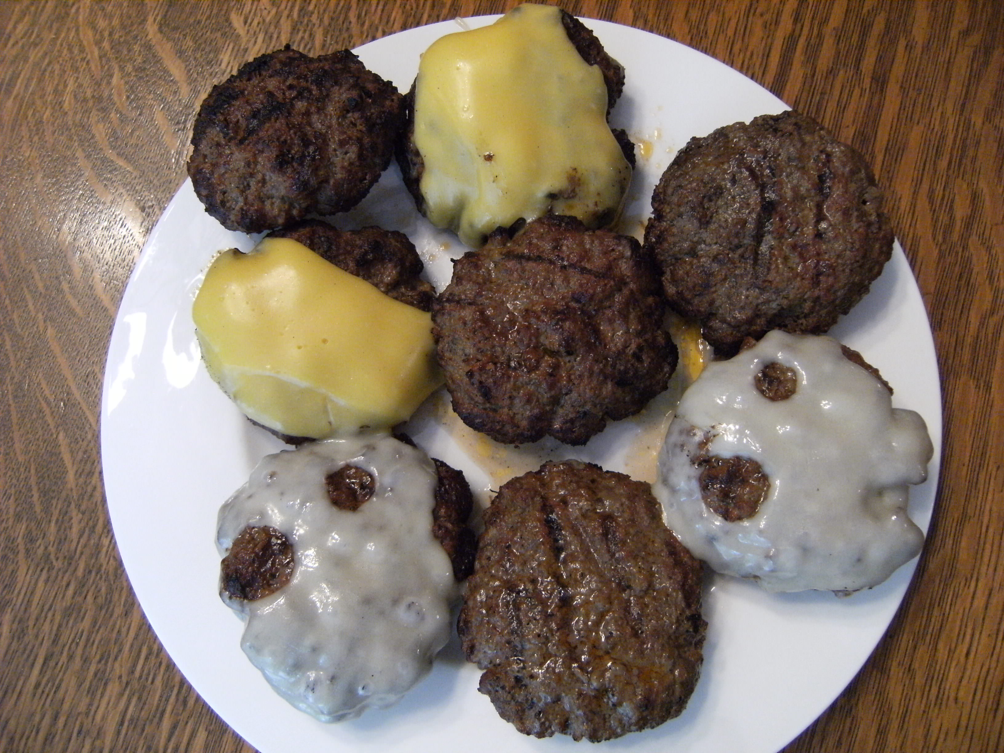 Butter burgers with an assortment of cheeses - Get the recipe for these butter burgers at ComfortablyDomestic.com