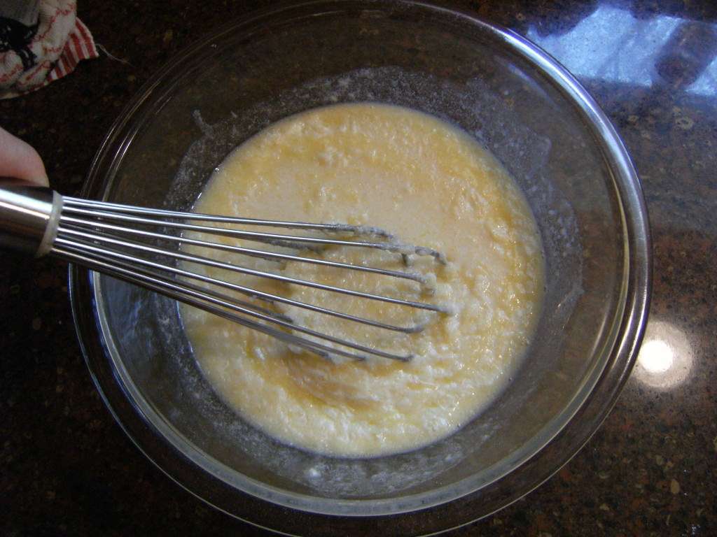 Whisking ingredients for homemade corn muffins