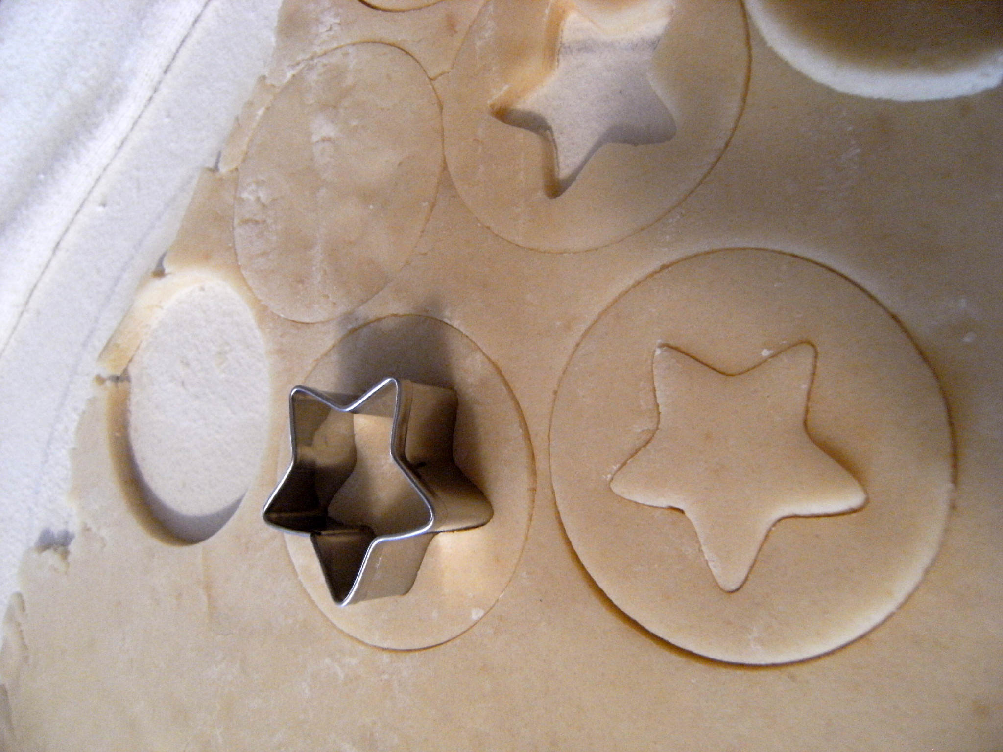 Shortbread Linzer Cookies being cut out