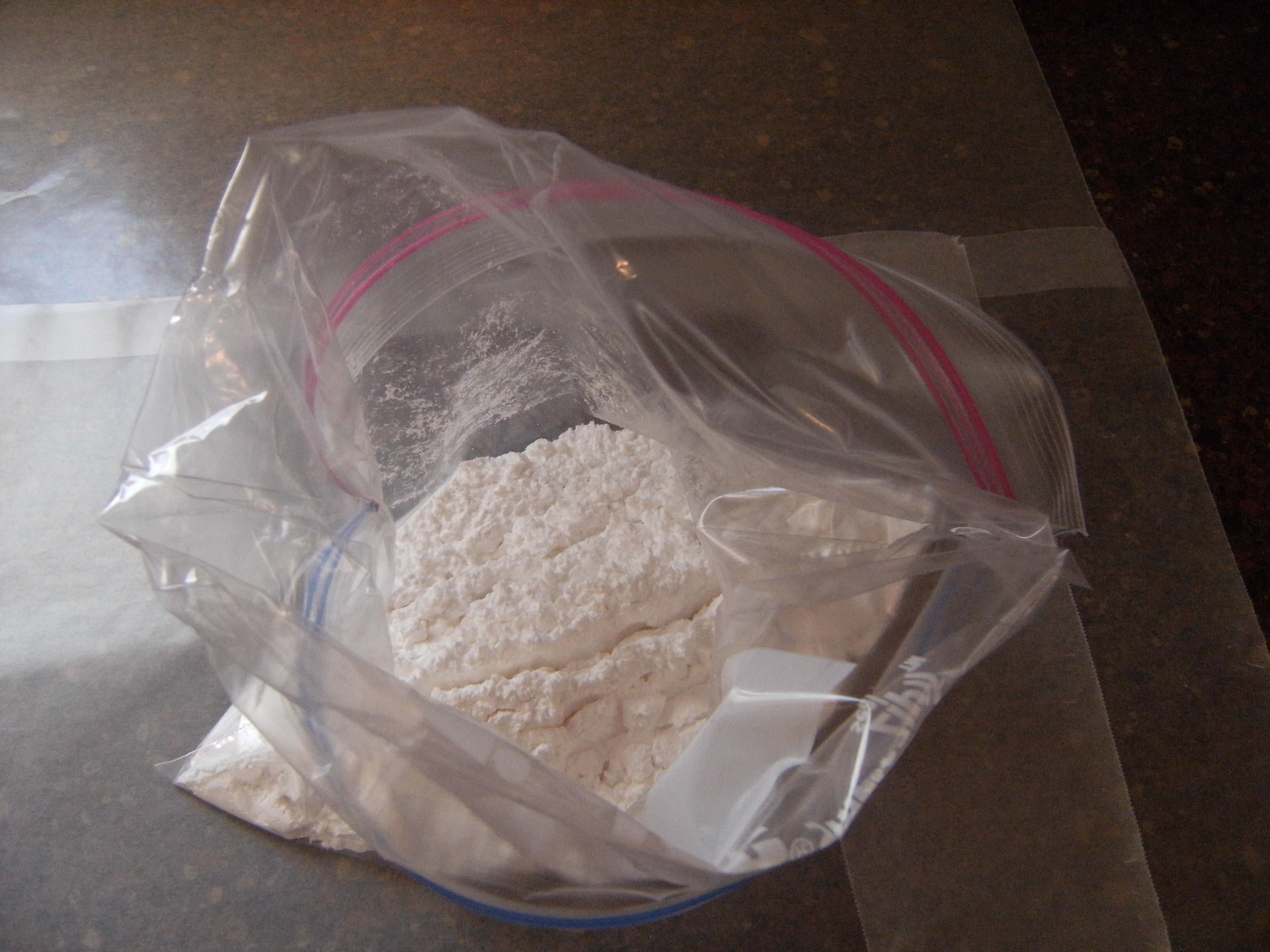 A plastic bag full of powdered sugar