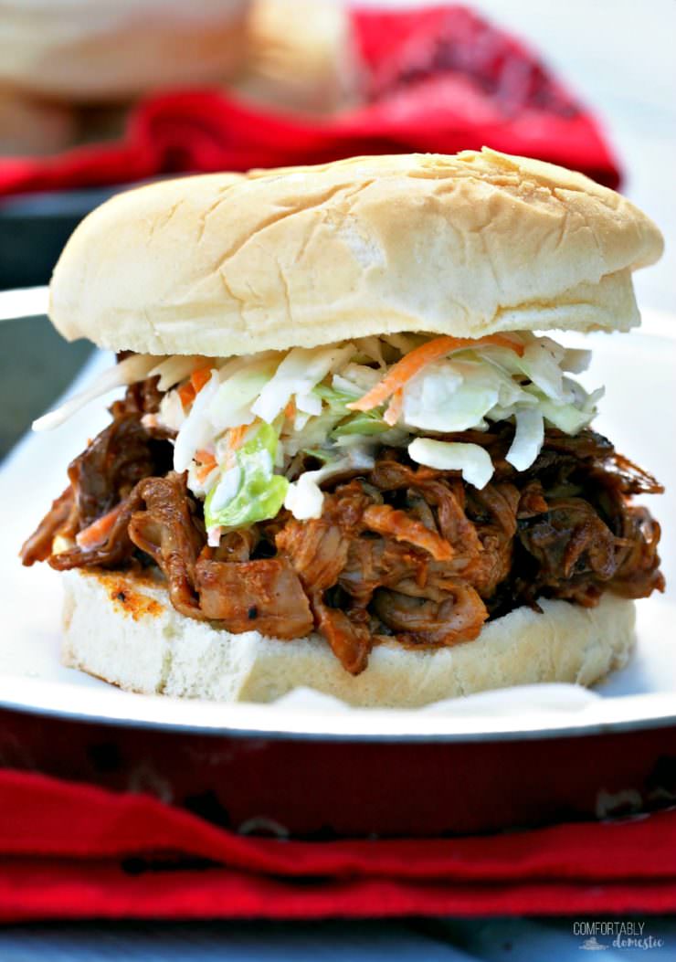 Slow-Cooker-BBQ-Pulled-Pork is an easy, delicious way to feed a crowd. These stick-to-your-ribs comfort food sandwiches with fresh cole slaw will have guests clamoring for more.