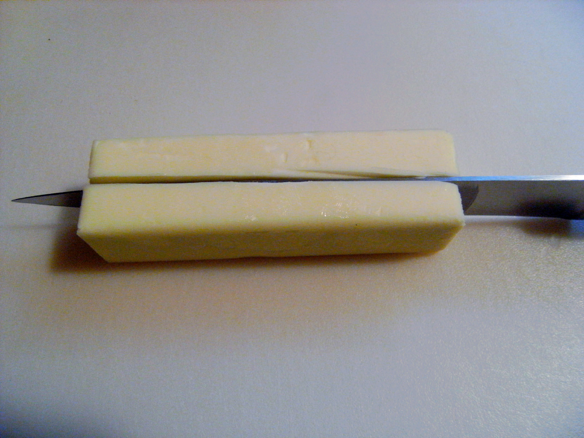 a stick of butter, cut in half