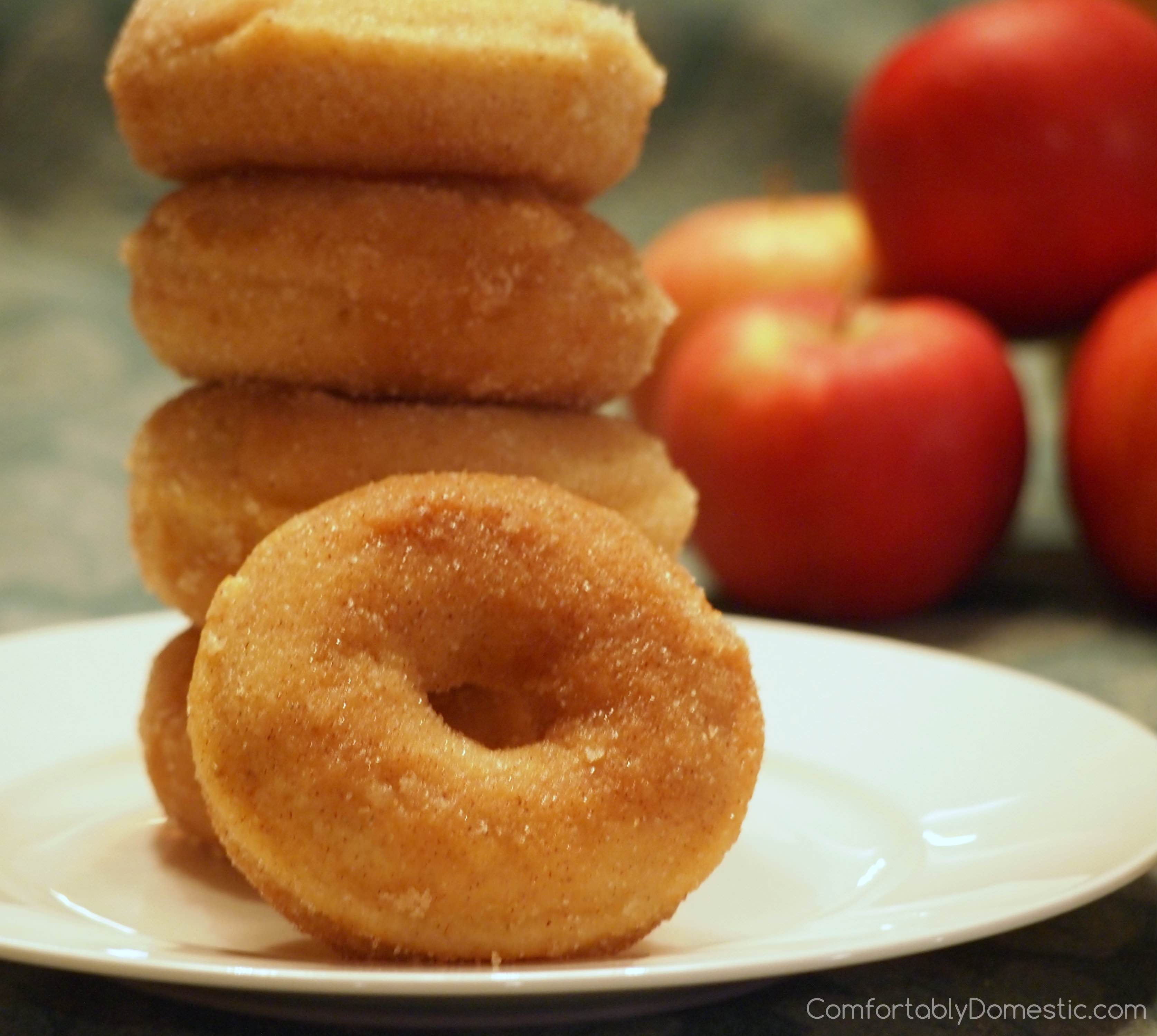 Baked Apple Cinnamon Doughnuts | ComfortablyDomestic.com are soft, delicious doughnuts with fresh apples inside and a sweet cinnamon sugar coating. Recipe includes directions to make as muffins, too!
