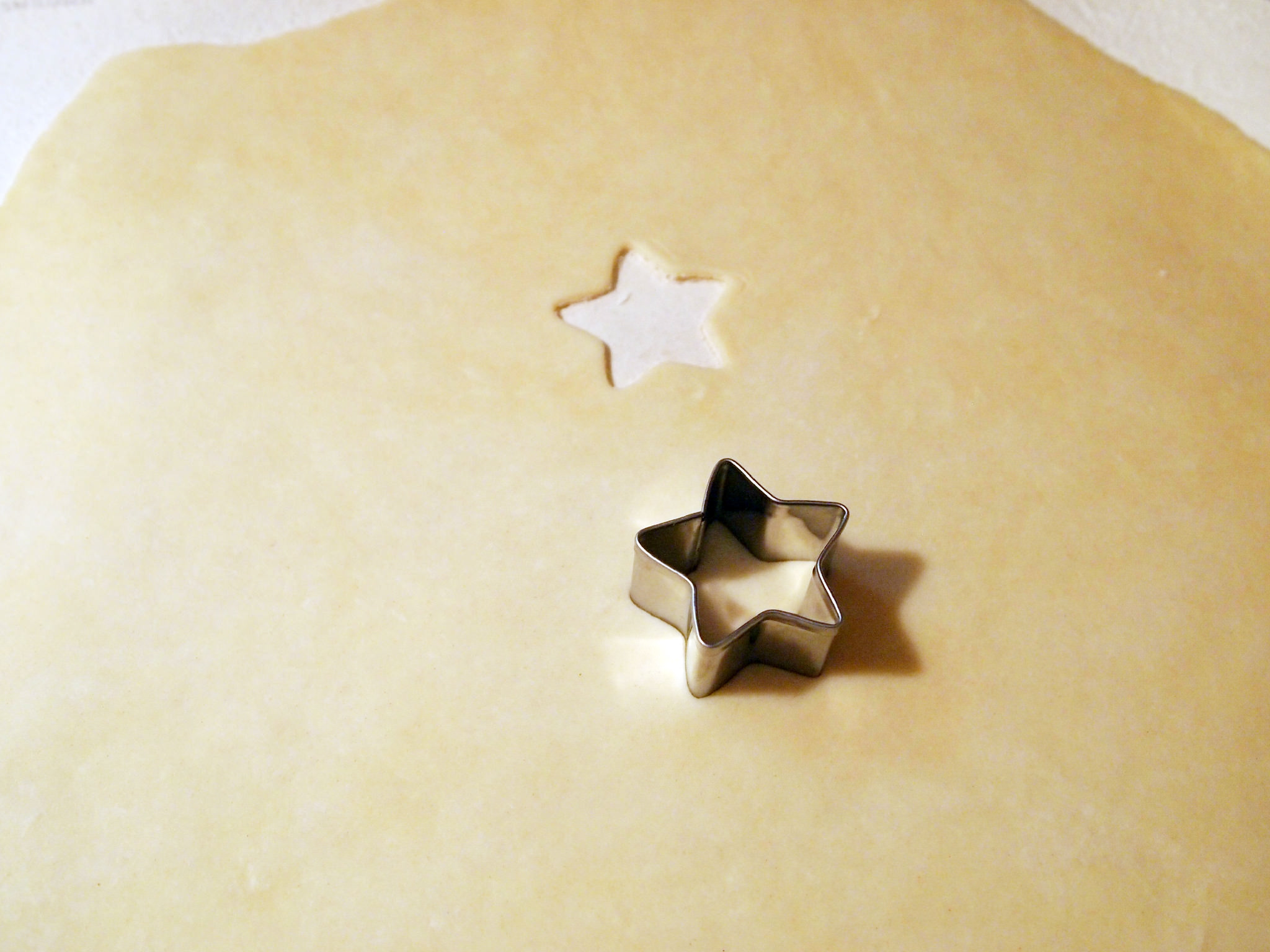 cutting stars out of pastry crust for a chicken pot pie