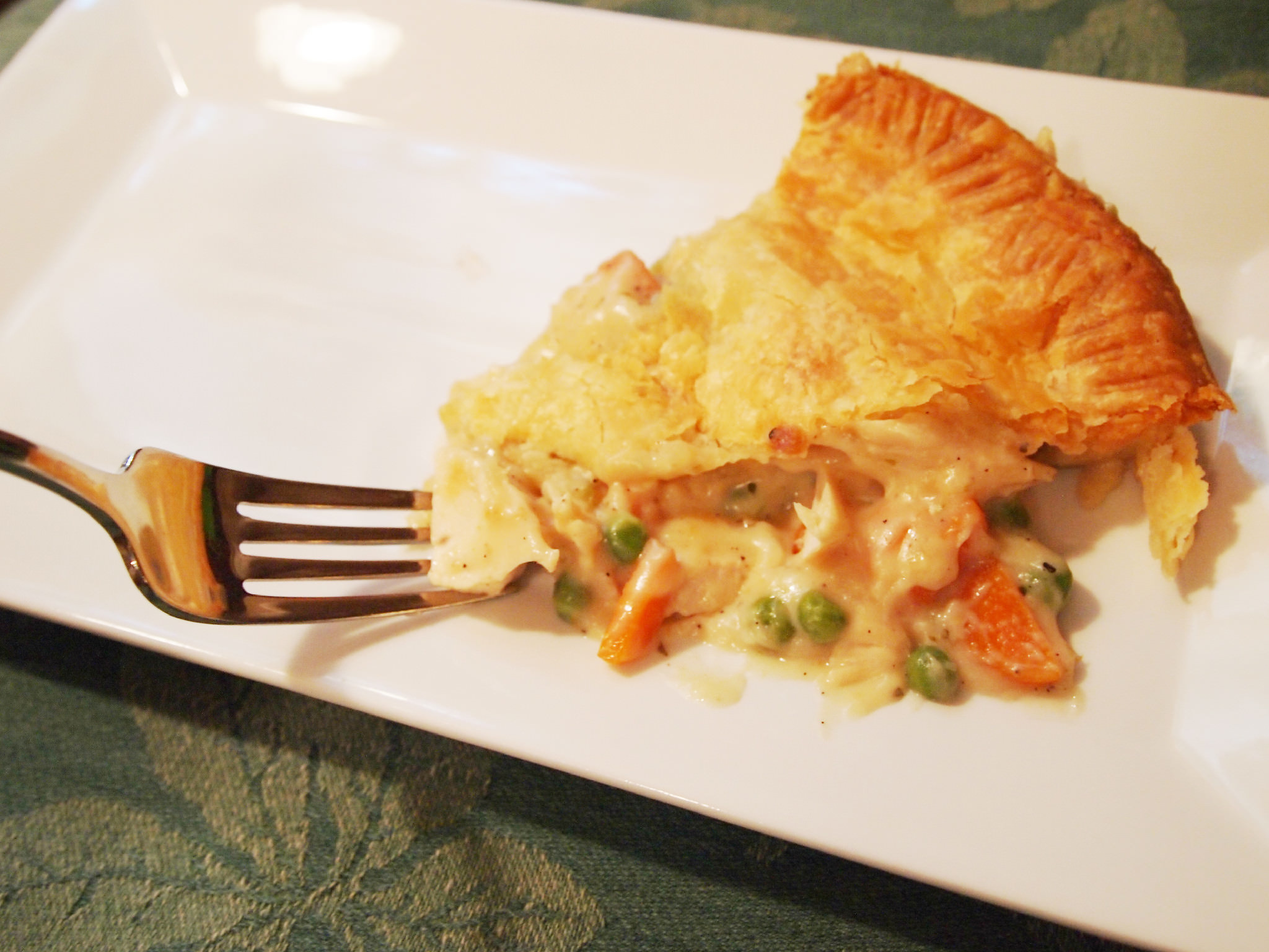 Chicken pot pie. Nothing says 'comfort food' better than tender chicken and vegetables in a rich gravy, covered with a flaky, buttery pastry crust. | Recipe on ComfortablyDomestic.com