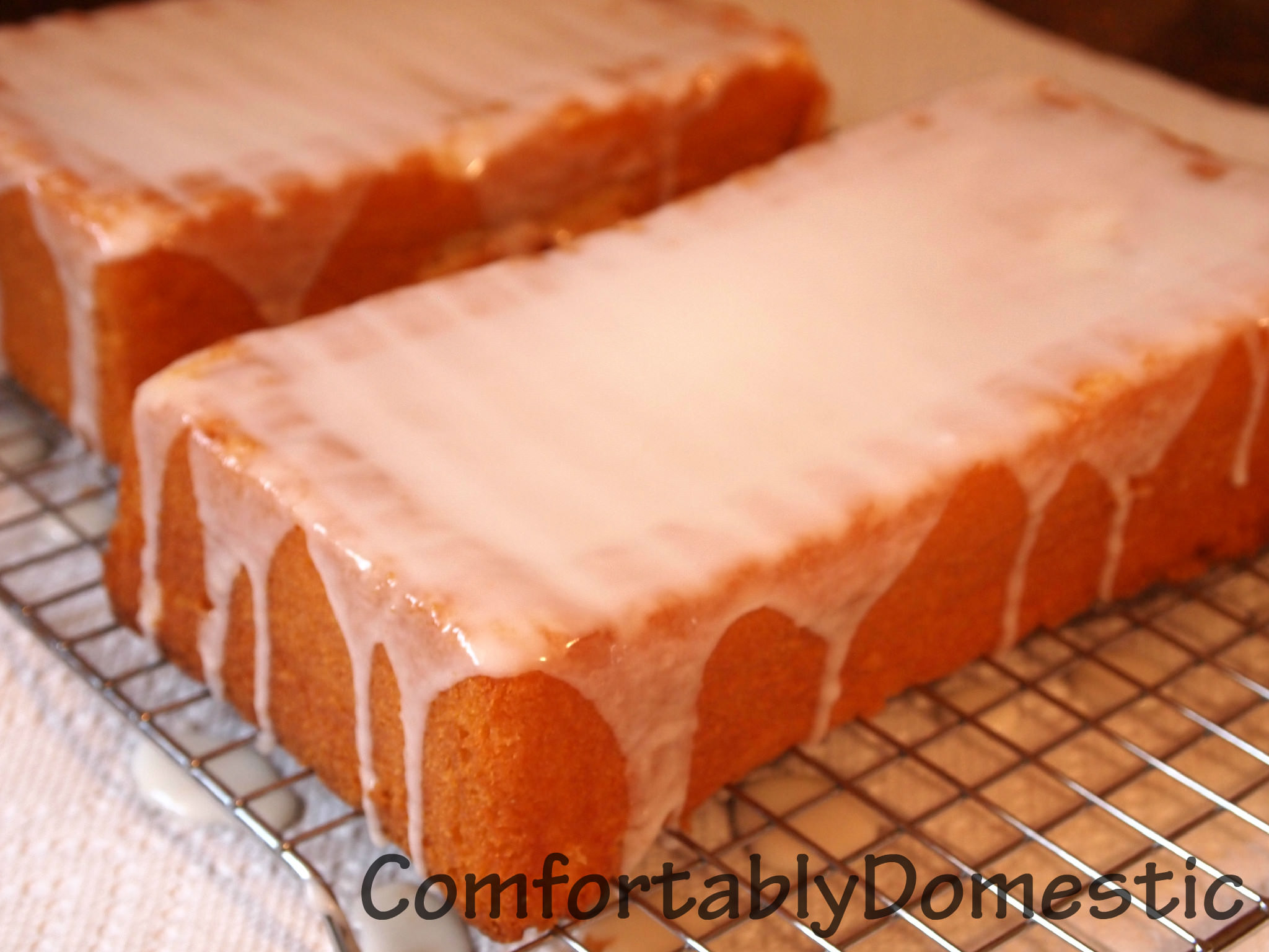 Iced lemon loaf is the perfect treat with a cup of coffee. Now there's no need to get it at the local coffee shop, because you can make it at home for a fraction of the cost!