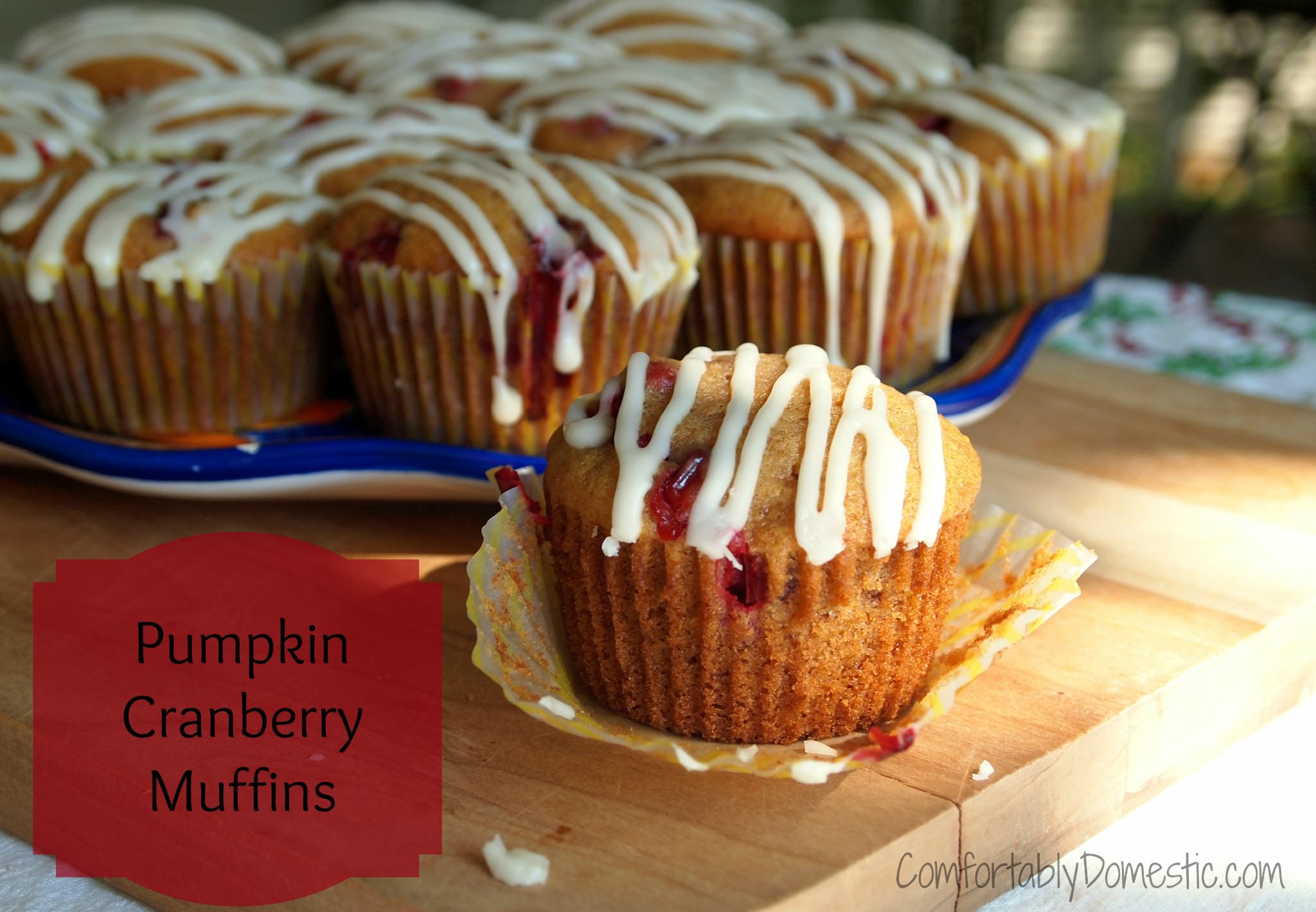 Pumpkin cranberry muffins  use the best flavors of fall to create a moist, fluffy muffin for breakfast or any time snack. The drizzle of sweet glaze on top takes them over the top. | ComfortablyDomestic.com