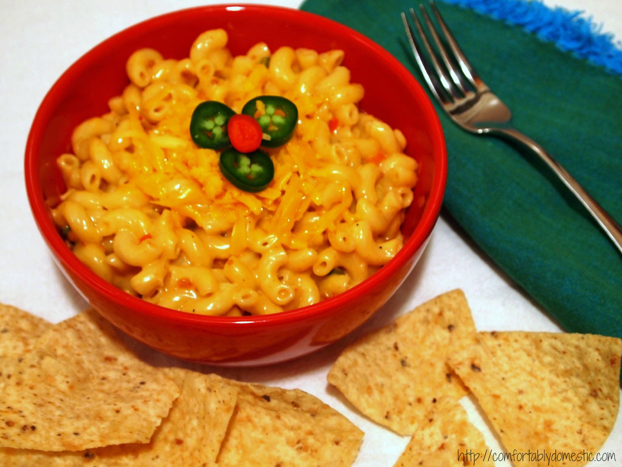 Queso macaroni and cheese is tender macaroni, drenched in a creamy Wisconsin cheese sauce, peppered with all the flavors of a queso dip. | ComfortablyDomestic.com
