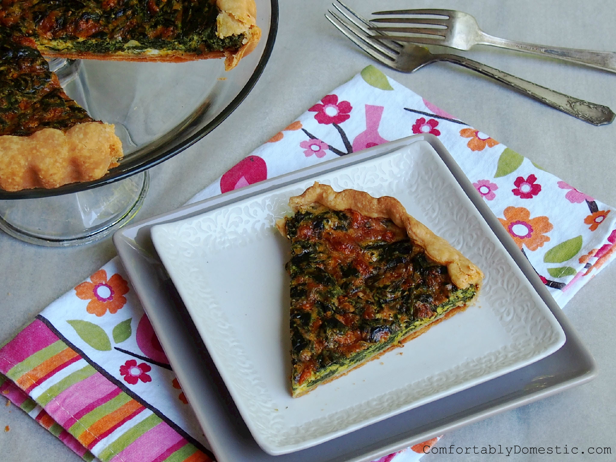 Fresh spinach, acquired through a CSA (Community Supported Agriculture) food co-op goes into making this egg-based, meatless, fresh spinach tart. | ComfortablyDomestic.com