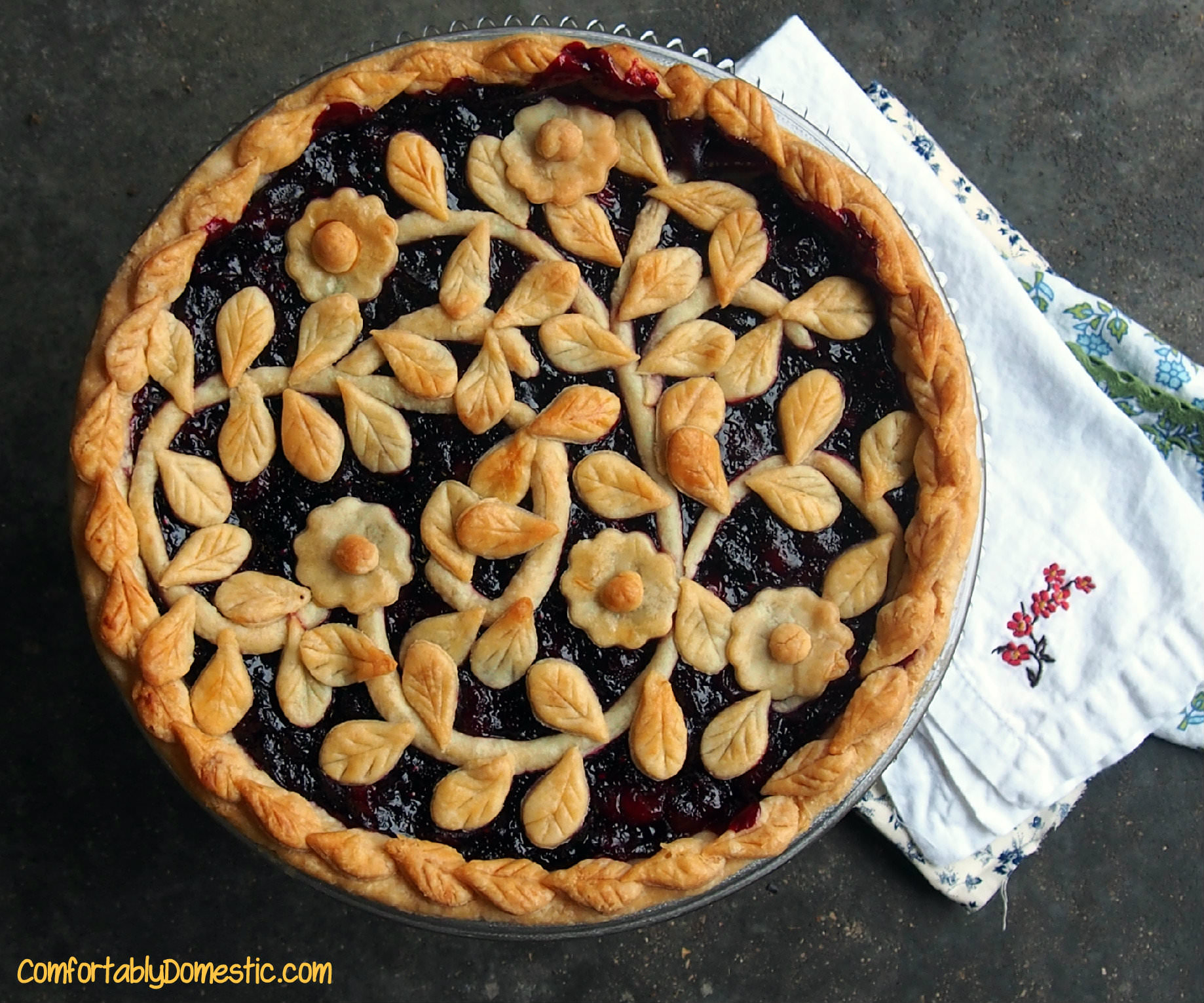 Very berry cherry pie, with its fresh cranberries, wild blueberries, and tart cherries, has show stopping flavor. This pie is bound to be requested again and again. || ComfortablyDomestic.com