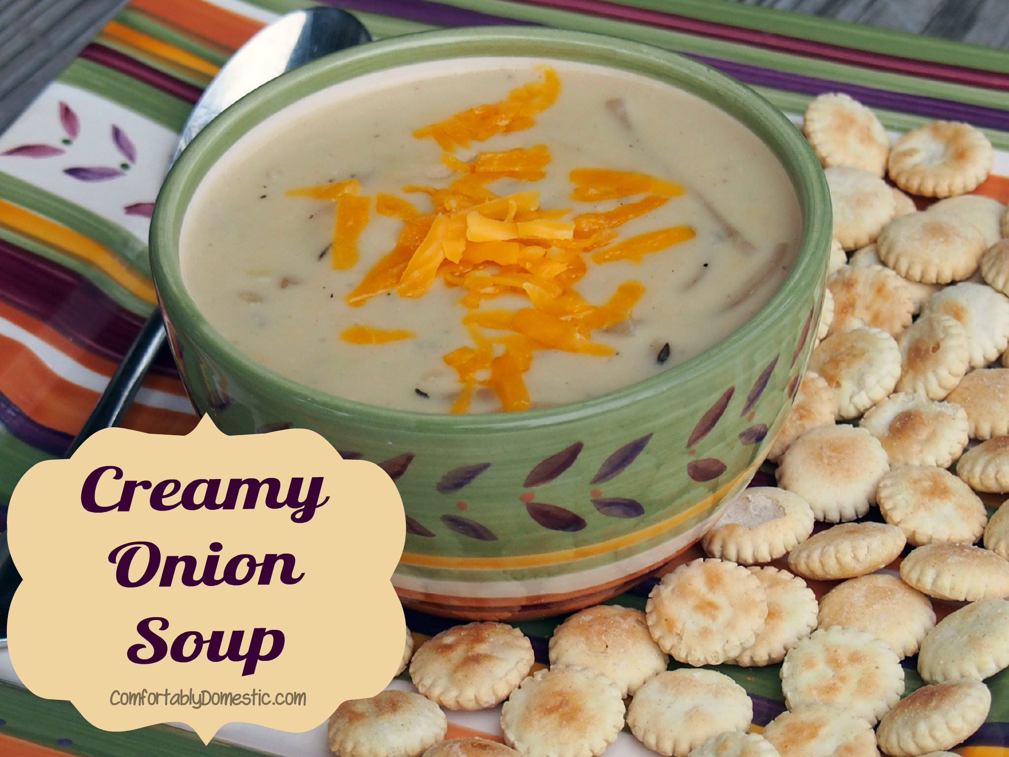 Creamy onion soup has loads of tender sweet onions, swimming in a flavorful, blended cheese base. This soup is a soothing meal or side dish. | ComfortablyDomestic.com