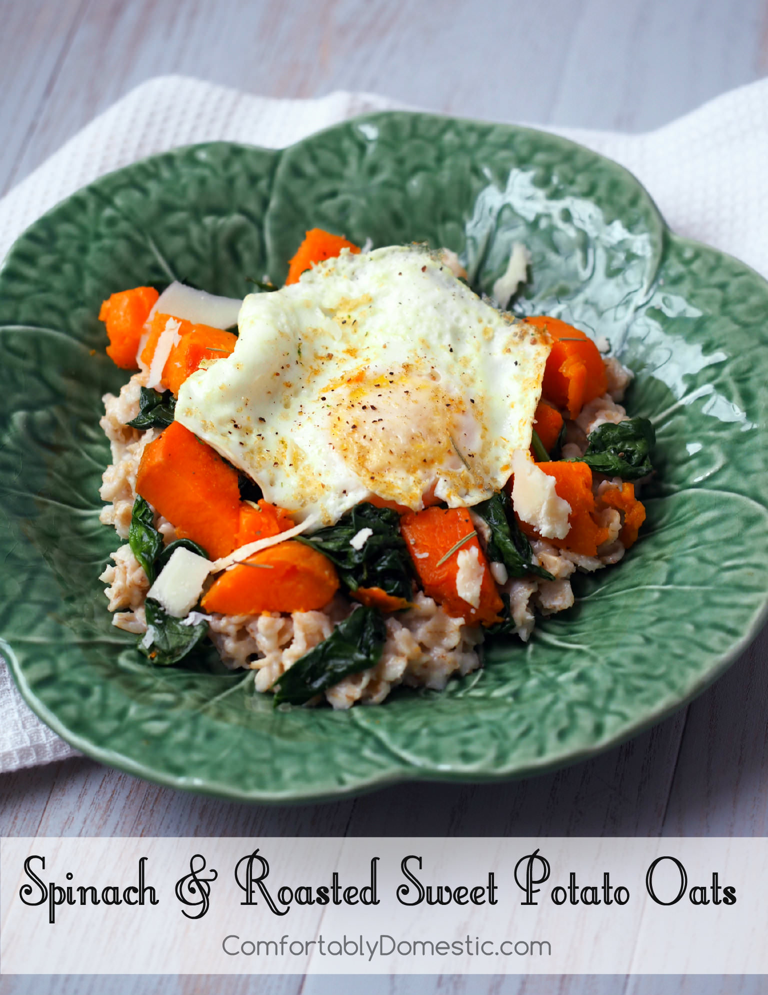 Savory oats are an infinitely satisfying way to start the day! Vibrant spinach, roasted sweet potatoes, and a farm fresh egg rest atop a bed of healthy oats for a delicious breakfast. | ComfortablyDomestic.com