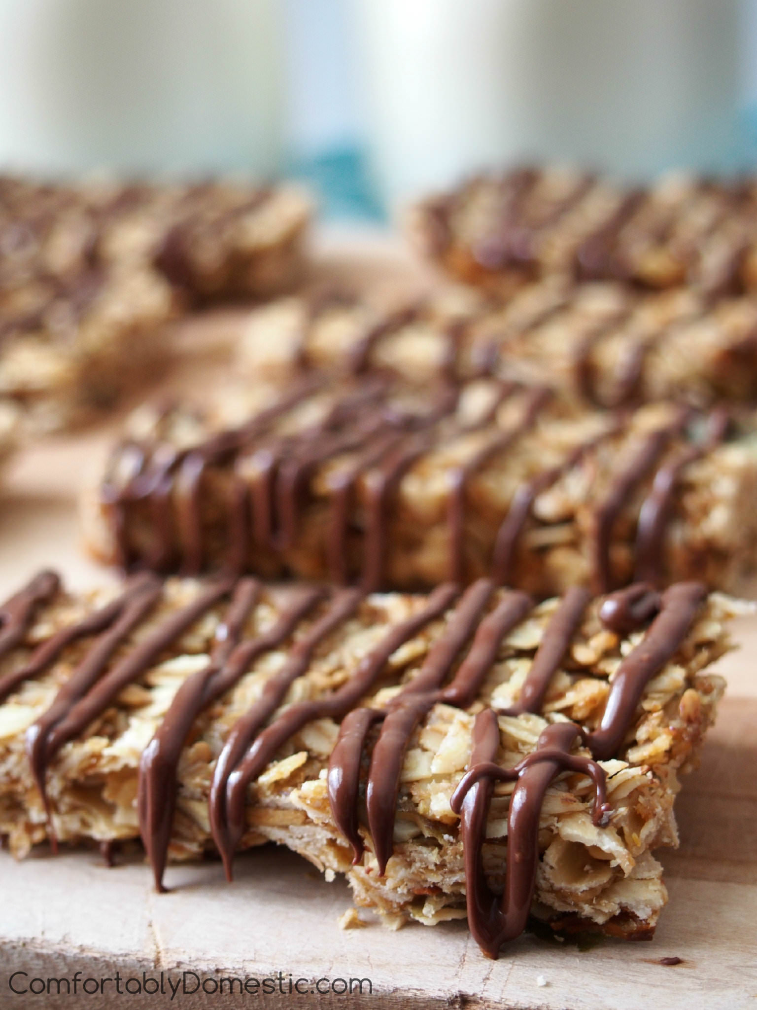 Crunchy Granola Bars are a distinctively crunchy, homemade granola bar with healthy oats, nuts, and chocolate. This recipe is a wholesome snack on the go. | ComfortablyDomestic.com