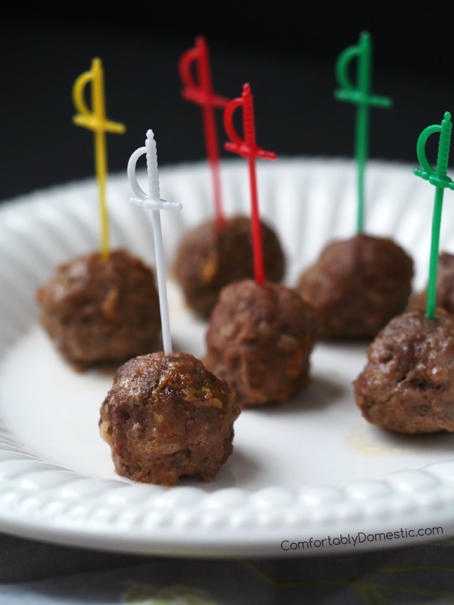 Soy ginger meatballs are the perfect appetizer! Delicious, tender meatballs, simmered in a sweet soy ginger sauce, with just a touch of heat. | ComfortablyDomestic.com
