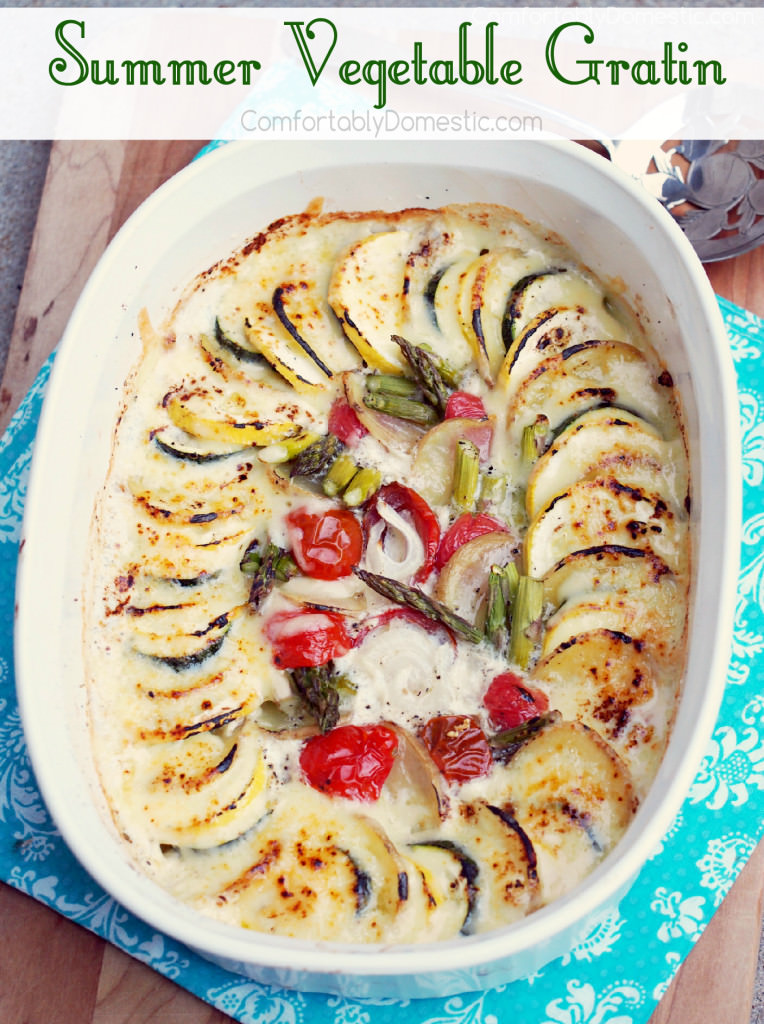 Summer vegetable gratin casserole will become an instant family favorite recipe. Vibrant summer vegetables braised in milk with a touch of butter and grated white cheddar cheese. | ComfortablyDomestic.com