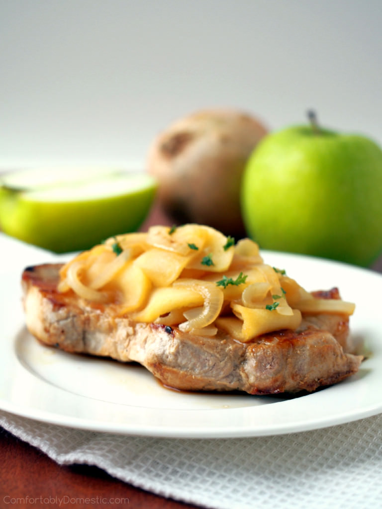 Apple Cider Pork Chops with Apples and Onions - Boneless pork loin chops seared to seal in the juices, and then simmered with delicately spiced apple cider, fresh apples, and onion for a sweet and savory meal in 30 minutes. | ComfortablyDomestic.com