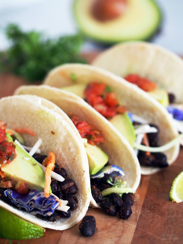Spicy-Roasted-Black-Bean-Tacos is an easy vegetarian meal made with seasoned black beans, oven roasted to enhance the depth of the spices and compliment the satisfying fresh flavors. These tacos are anything but bland or ordinary!