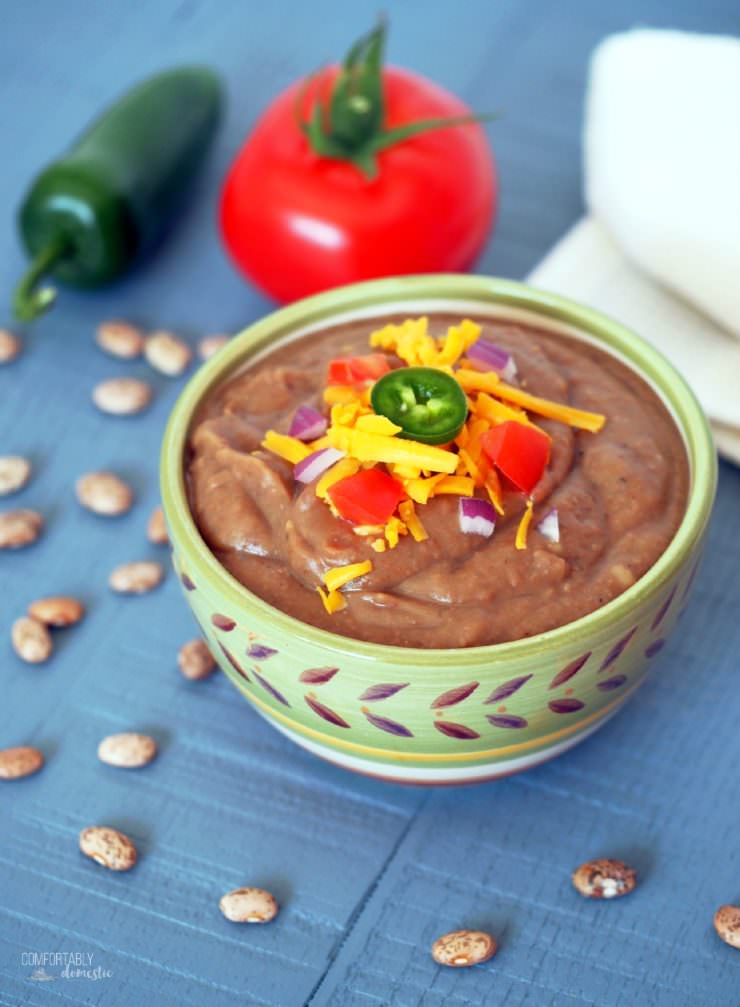 Slow-Cooker-Refried-Beans are so easy, creamy and full of flavor that you'll never reach for the canned variety again! via ComfortablyDomestic.com