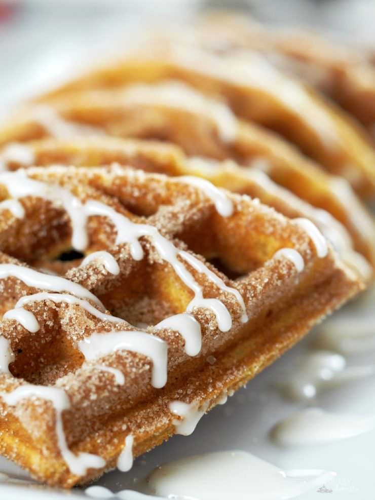 Pumpkin-Churro-Waffles-with-Cream-Cheese-Icing, reminiscent of the popular street fair snack, are loaded with all the pumpkin and warm spiced flavors of fall with crisp, cinnamon sugared edges and an interior texture that practically melts in your mouth. 
