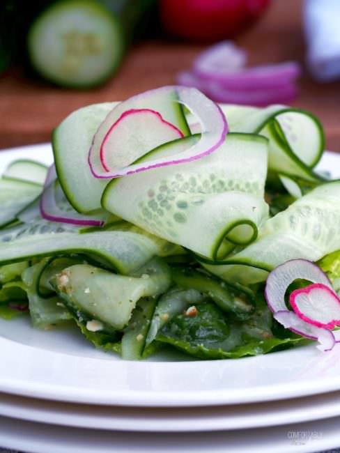 Cucumber-Ribbon-Salad tosses fun ribbons of ripe cucumber and other vegetables with a flavorful fresh pesto dressing in a cool and crunchy summer salad.