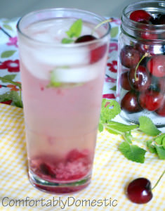 Cherry Mojito cocktails are an adult summer refreshment. Tangy lime, fresh mint, and Traverse City Michigan cherries combine with rum to make this delicious cherry mojito! | ComfortablyDomestic.com