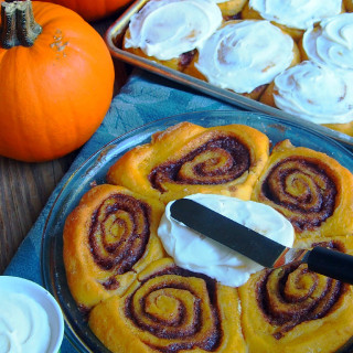 Pumpkin cinnamon rolls usher in the cool comfort of autumn any time of the year. Piping hot, and just dripping with cream cheese icing.