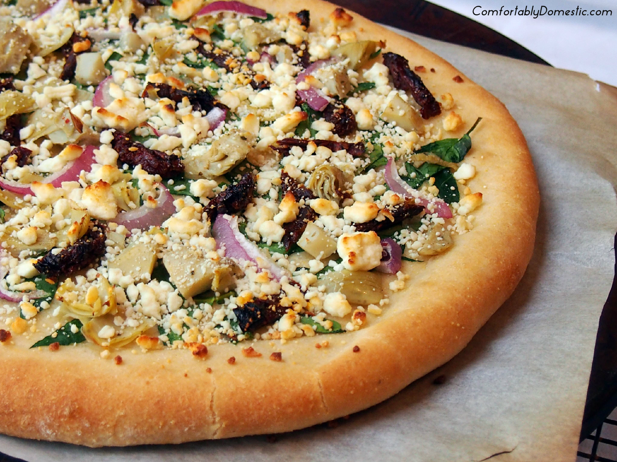 Pizza greek recipe cornmeal crust feta spinach comfortablydomestic mediterranean artichoke tomatoes sundried onion hearts cheese red