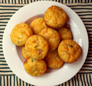 Omelette Muffins | ComfortablyDomestic.com - Eggy breakfast muffins are stuffed with shredded vegetables, plenty of cheese, and diced ham (or bacon) for a complete breakfast on the go!