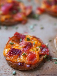 Steak potato rounds have the taste of a loaded baked potato in a two-bite appetizer. Bake sliced yellow potato rounds to tender perfection, then smother them with steak sauce, aged cheddar cheese, crisp bacon, and chives. | ComfortablyDomestic.com