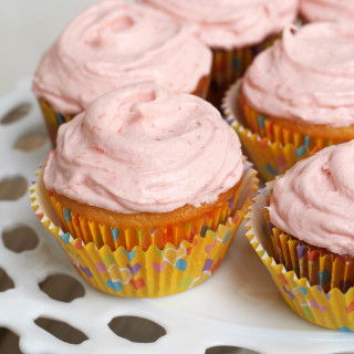 Strawberry Lemonade Cupcakes from scratch - Bright and tangy lemon cupcakes made from scratch and topped with a glorious fresh strawberry buttercream frosting is a delightfully crave-able combination. | ComfortablyDomestic.com