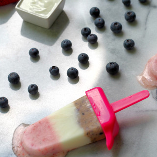 Red White and Blueberry Frozen Yogurt Pops - Sweet vanilla yogurt blended with fresh strawberries and blueberries, and then layered for a guilt-free, fun, and creamy frozen treat. | Comfortably Domestic