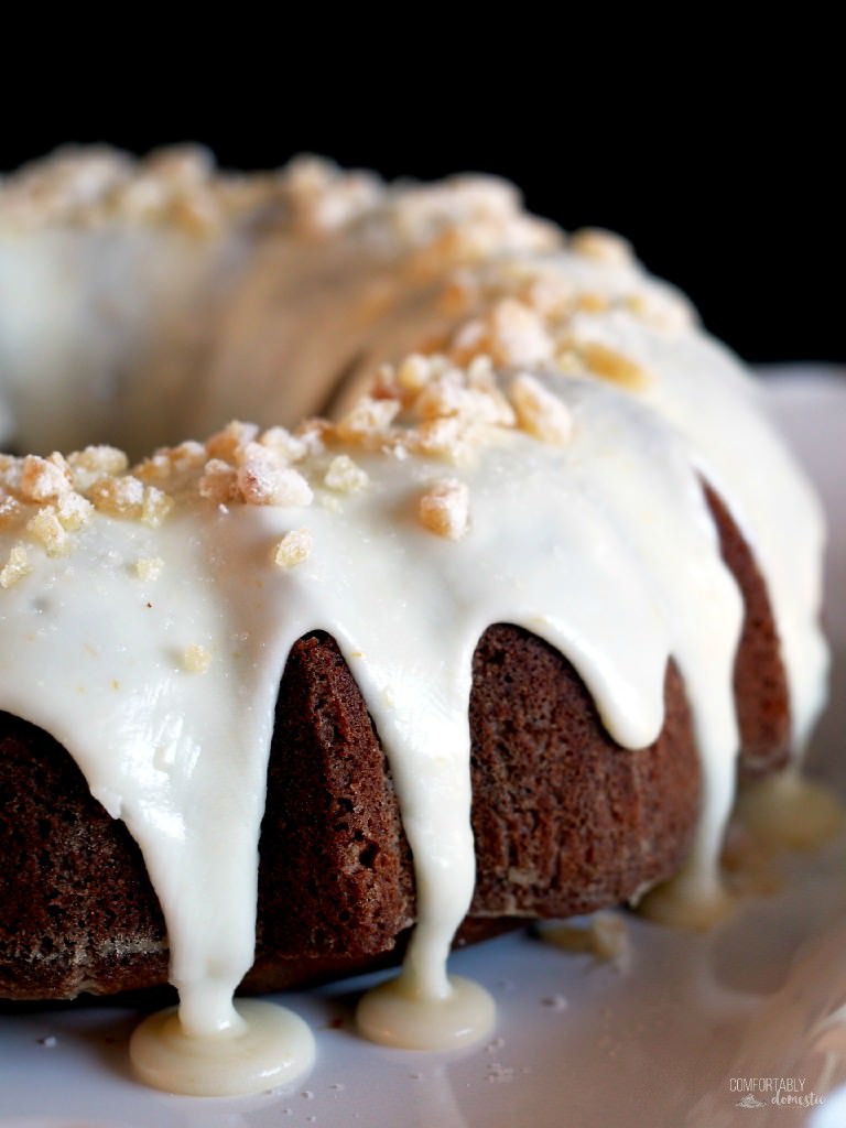 Gingerbread cake is richly spiced, tickling the tongue with added depth of molasses, brightened with citrus notes of orange cream glaze on top. | ComfortablyDomestic.com