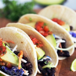 Spicy-Roasted-Black-Bean-Tacos is an easy vegetarian meal made with seasoned black beans, oven roasted to enhance the depth of the spices and compliment the satisfying fresh flavors. These tacos are anything but bland or ordinary!