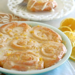 Lemon Sweet Rolls are sliced, soft sweet bread rolled into pinwheels with a buttery, lemon sugar filling and topped with a zesty lemon cream cheese icing.