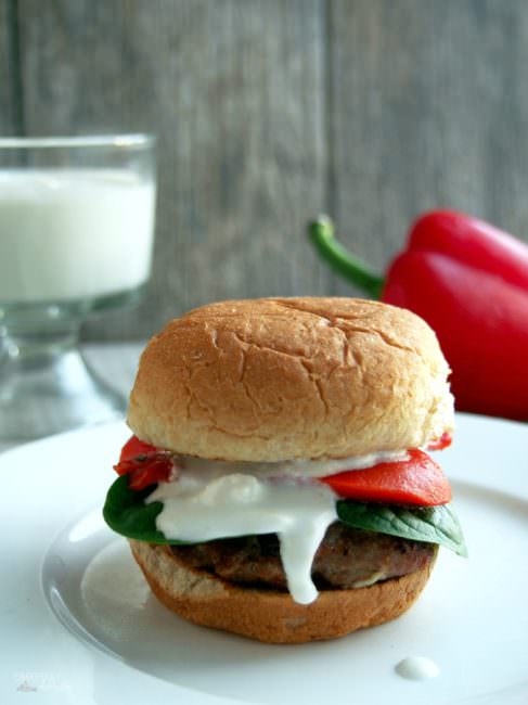 Greek-Turkey-Slider-Burgers are juicy, fun-sized lean ground turkey burgers that are well seasoned with Greek-inspired herbs and spices, seared over a hot grill to seal in the juices, and topped with a fantastic feta cheese sauce.