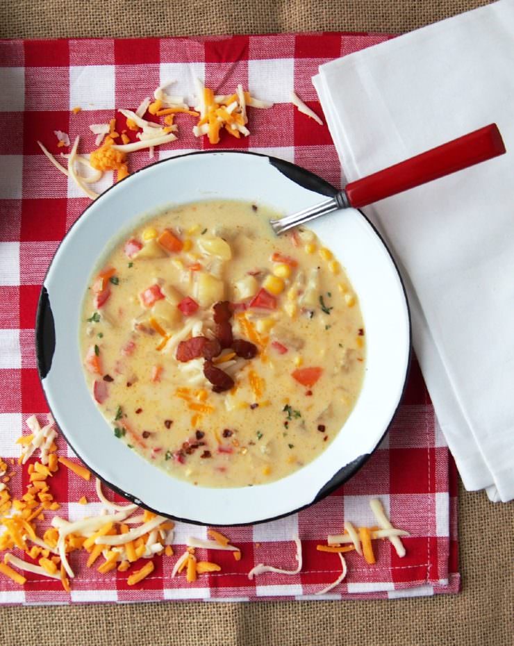 3-Cheese-Corn-Chowder is full of all the comforts of home with plenty of vegetables, crisp bacon, and three types of creamy cheeses in one flavorful soup.