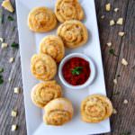 Cheesy-Italian-Herb-Pinwheels are buttery biscuits rolled with Italian seasoning and plenty of cheese for a savory three-bite appetizer that everyone will enjoy.