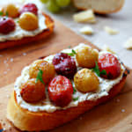 Roasted-Grapes-Crostini caramelizes sweet grapes with a light balsamic dressing before nestling them on a savory bed of ricotta and crisp, buttery toast. This is one appetizer to remember!