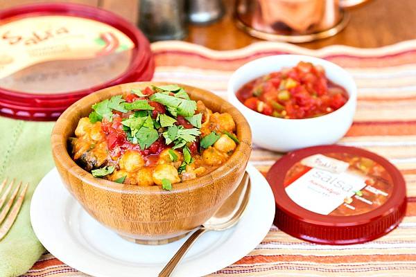 cup-of-spicy-vegan-chickpea-chili-surrounded-by-toppings