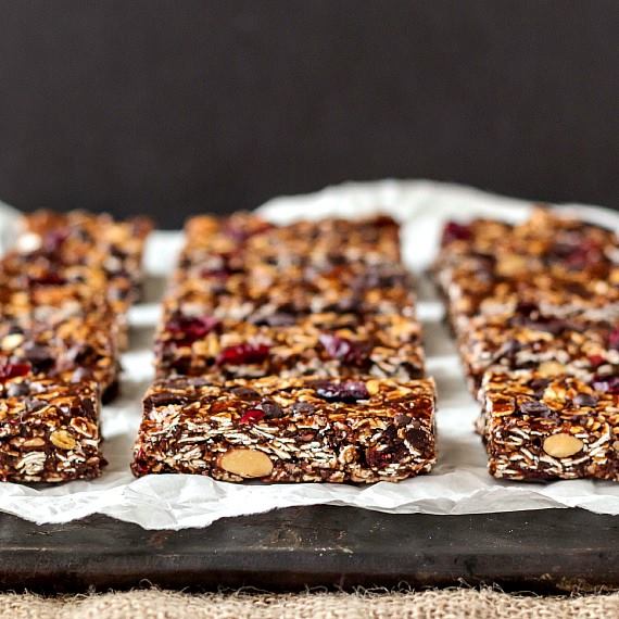 no-bake-granola-bars-artfully-arranged-on-parchment-paper-and-a-cutting-board
