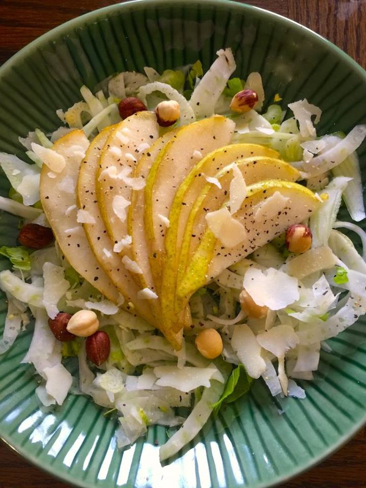 salad-with-sliced-pears-on-a-green-plate