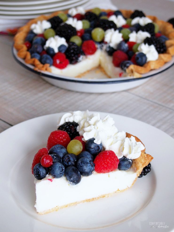 vanilla-cream-pudding-pie with fresh fruit sliced and served on a white plate