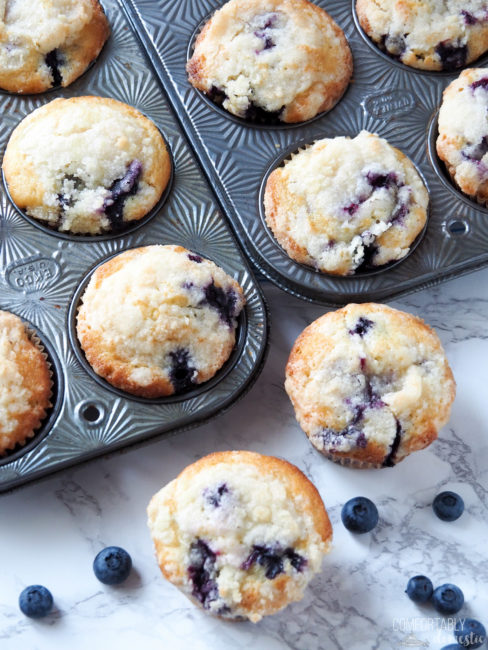 bakery style blueberry muffins in a vintage muffin tin.
