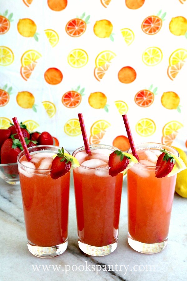 three glasses of strawberry lemonade arnold palmer drinks.