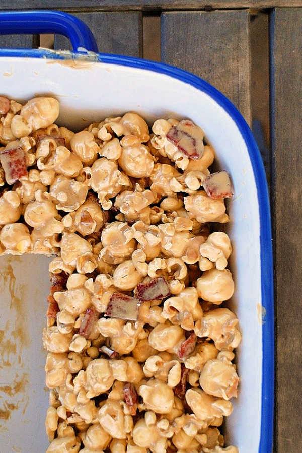 Maple bacon popcorn treats in a large white baking dish. 