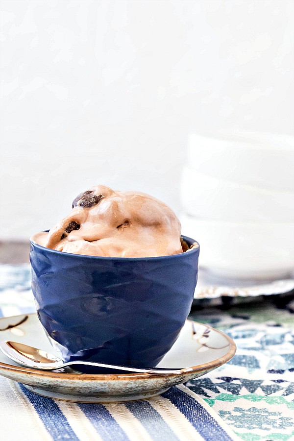 Giant scoops of No Churn Junior Mint Ice Cream in a cobalt blue bowl.