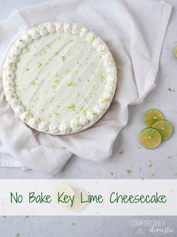 No Bake Key Lime Cheesecake on white background with fresh lime slices.